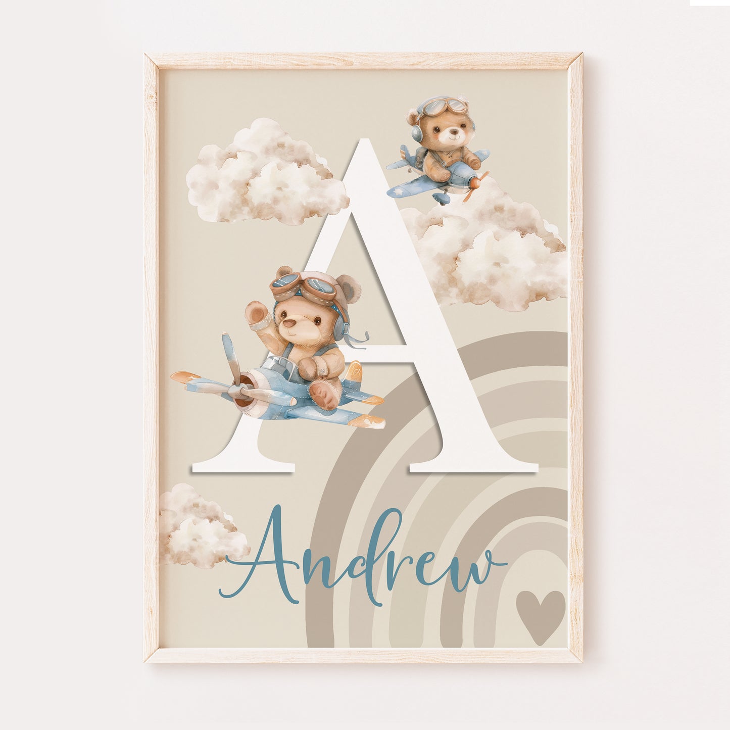 A cute whimsical baby boys nursery print illustrating your childs name written in a fancy font and the first initial in a large white serif font. The design has two teddy bears flying planes through the clouds set on a beige background with a beige rainbow in the corner.