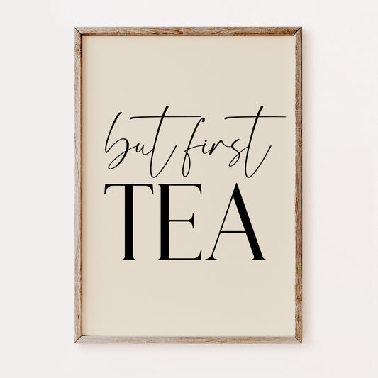 Framed print with 'but first TEA' text on a beige background