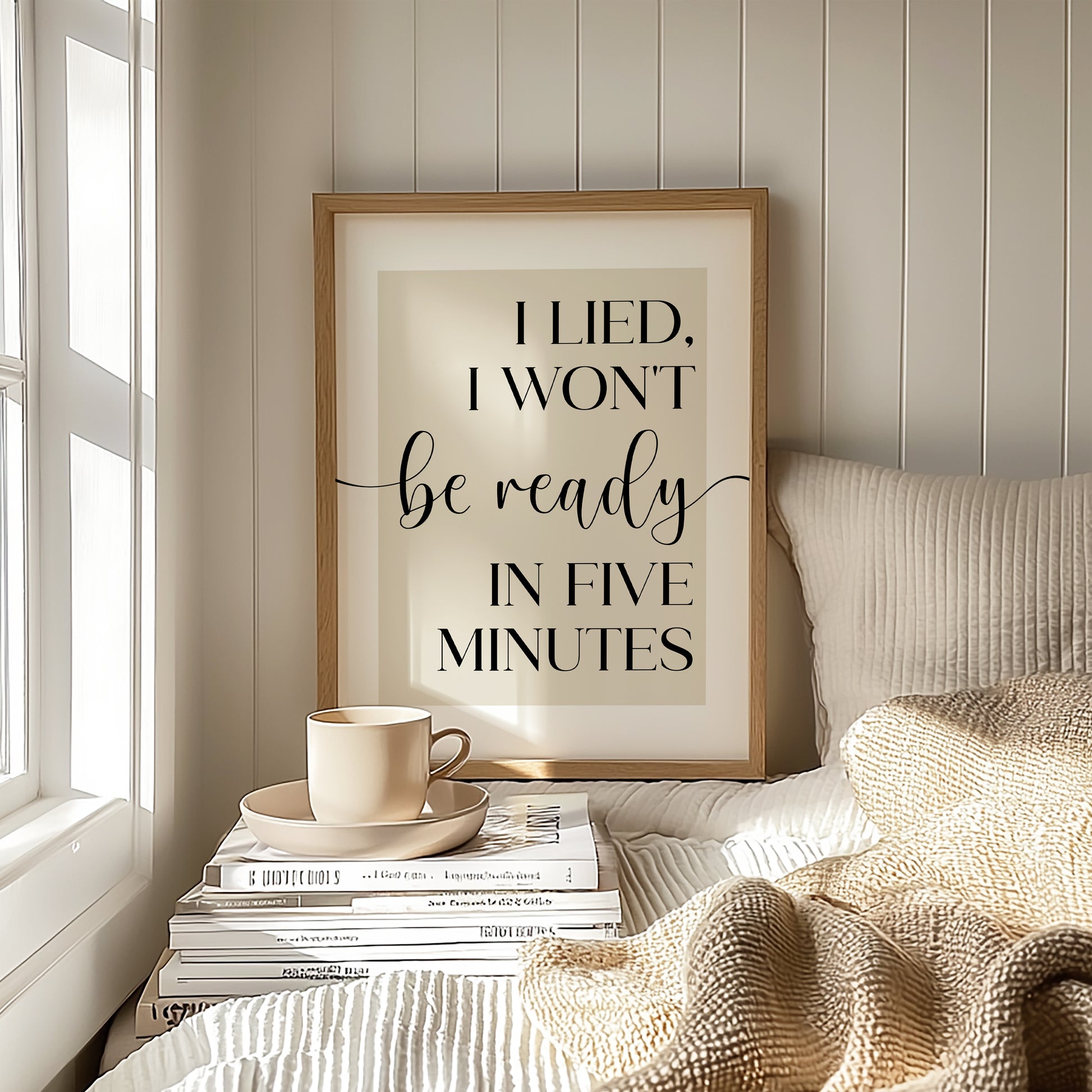 Framed print with humorous quote 'I lied, I won't be ready in five minutes' on a beige background. This makes a wonderful bedroom or dressing room print