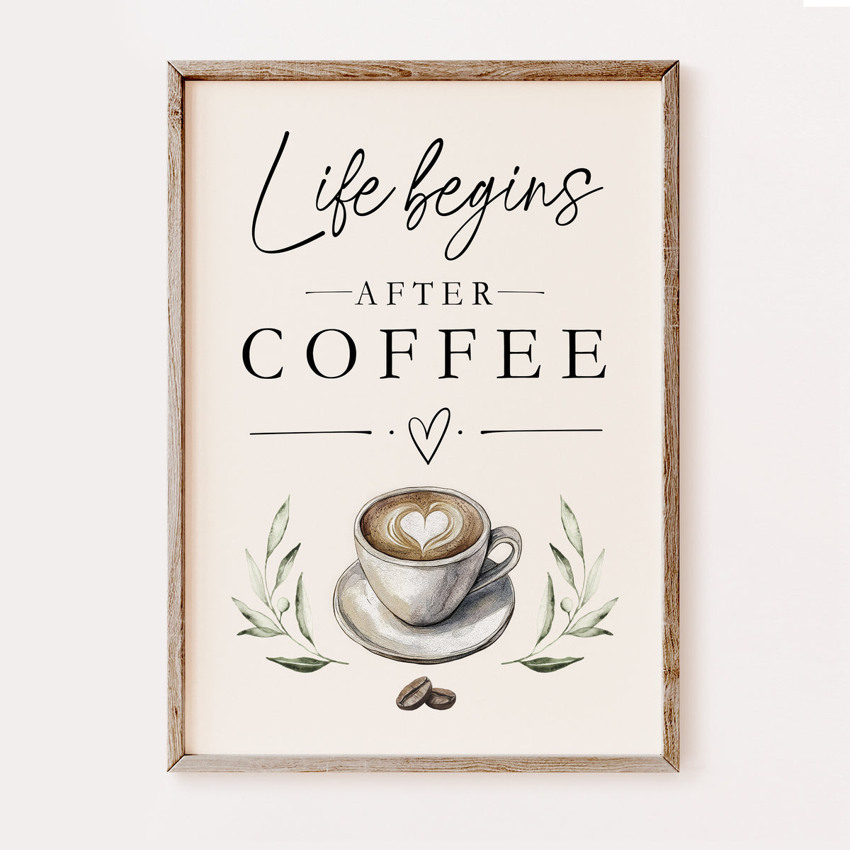 Framed wall art print with the phrase 'Life begins AFTER COFFEE' in black script and serif text, above a watercolor-style coffee cup with latte art, green leaves, and coffee beans, shown in a light wood frame against a plain light background.
