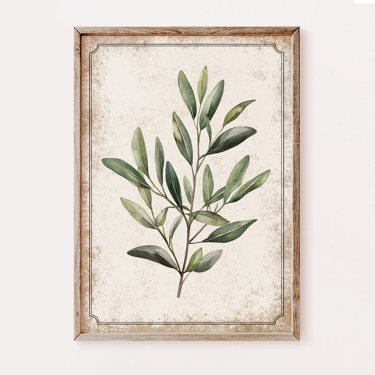 Framed botanical wall art featuring a green leafy branch illustration on a distressed cream background, enclosed in a rustic light wood frame and shown against a plain light wall.