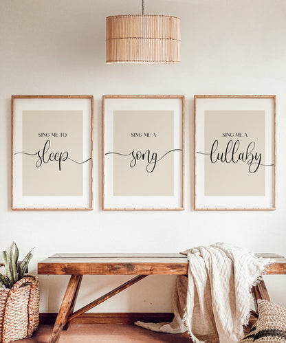 A set of 3 bedroom prints illustrating the words Sing me to sleep, Sing me a song, Sing me a lullaby' joined together with an elegant wavy black line and set on a range of background options for you to choose from.