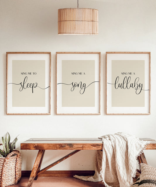 A set of 3 bedroom prints illustrating the words Sing me to sleep, Sing me a song, Sing me a lullaby' joined together with an elegant wavy black line and set on a range of background options for you to choose from.
