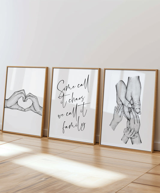 A beautiful family set of 3 prints illustrating a watercolour drawing in monotone colours of a couples hands forming a heart shape and then the parents and child holding hands with a heart warming quote in the middle saying 'Some call its chaos, we call it family'.