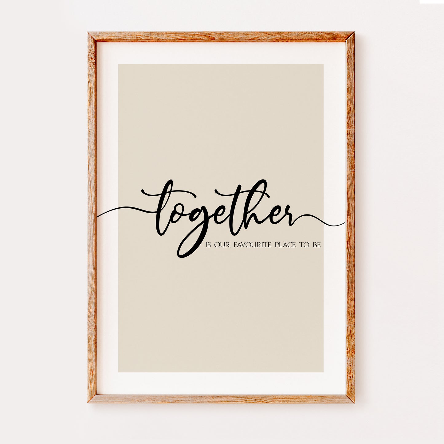 A quote print featuring the phrase 'Together is our favourite place to be', written in an elegant black font which flows from one side of the page to the other set on a beige background.