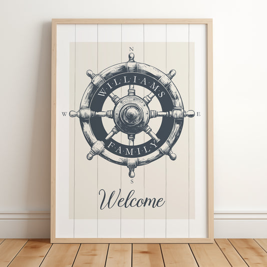 Framed nautical wheel print in a Navy colour on a Beige background with 'Williams Family - Welcome' text written in a stylish serif font on the wheel.